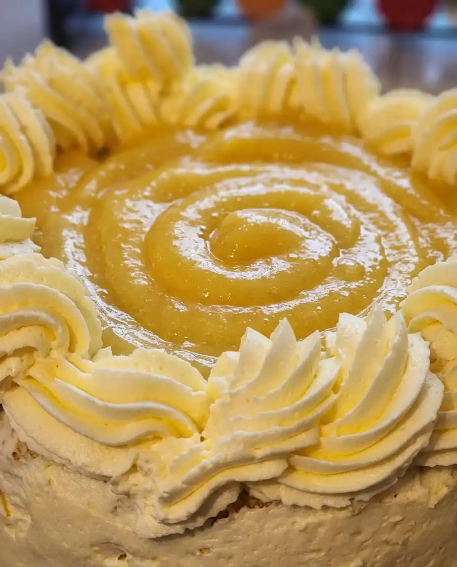 Orange Creamsicle Cake 14 A slice of orange creamsicle cake served next to a cup of dark coffee.