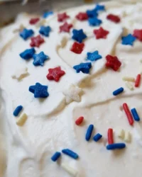 Cross section of a Red White and Blue Patriotic Poke Cake showing internal color stripes