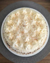 Three layer quick italian cream cake with cream cheese frosting and pecans