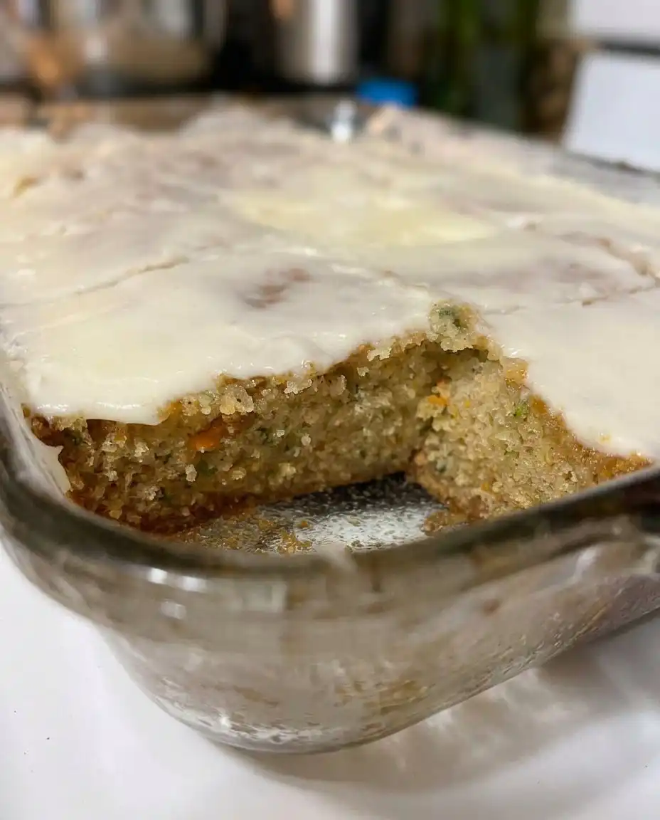 A plate of zucchini bars served with a glass of milk