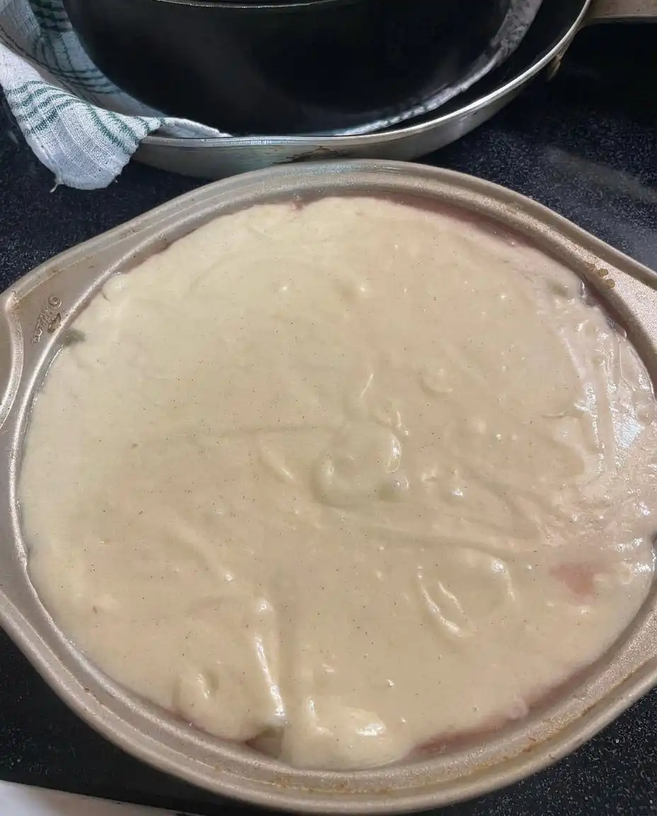 A bowl of thick pineapple mascarpone whipped cream with stiff peaks.