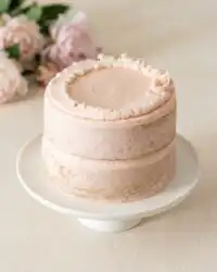 Two-Layer Smash Cake layers cooling on a wire rack in a sunlit kitchen