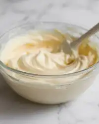 A close up of light and airy vanilla mousse cake filling