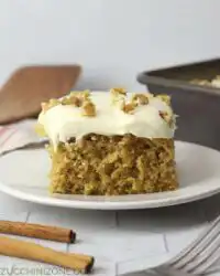 A close up of Zucchini Spice Cake with Cream Cheese Frosting showing the moist crumb.