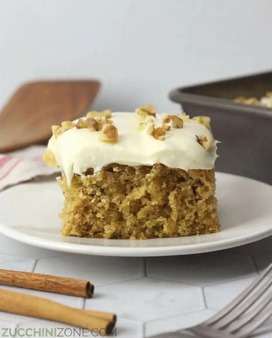 Zucchini Spice Cake with Cream Cheese Frosting 10 A close up of Zucchini Spice Cake with Cream Cheese Frosting showing the moist crumb.