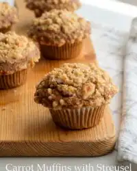 Freshly baked Carrot Cake Muffins with Streusel Topping resting on a wire cooling rack