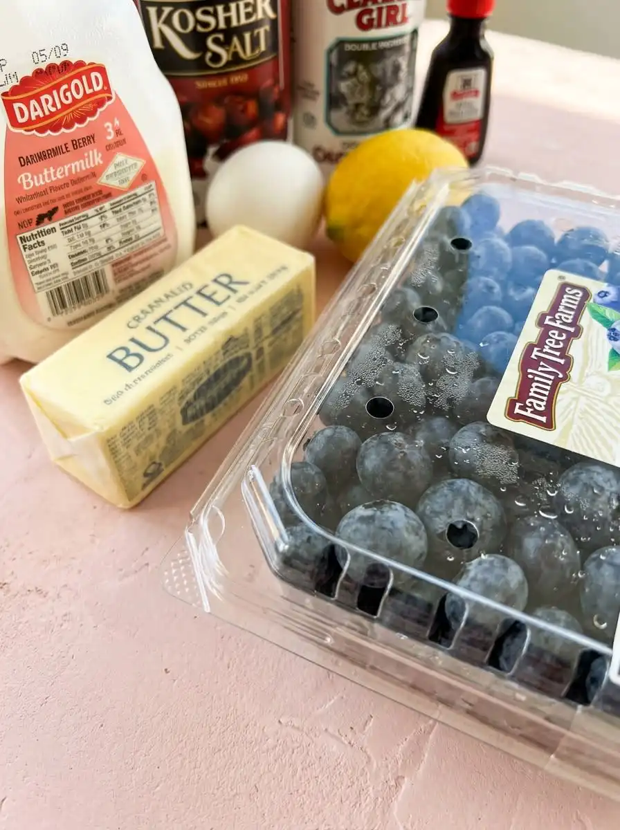 Blueberry Buttermilk Breakfast Cake 14 Fresh ingredients for making Blueberry Buttermilk Breakfast Cake arranged on a kitchen counter.