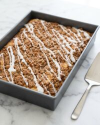 A single moist slice of Classic Streusel Coffee Cake showing the rich cinnamon swirl and buttery crumb.