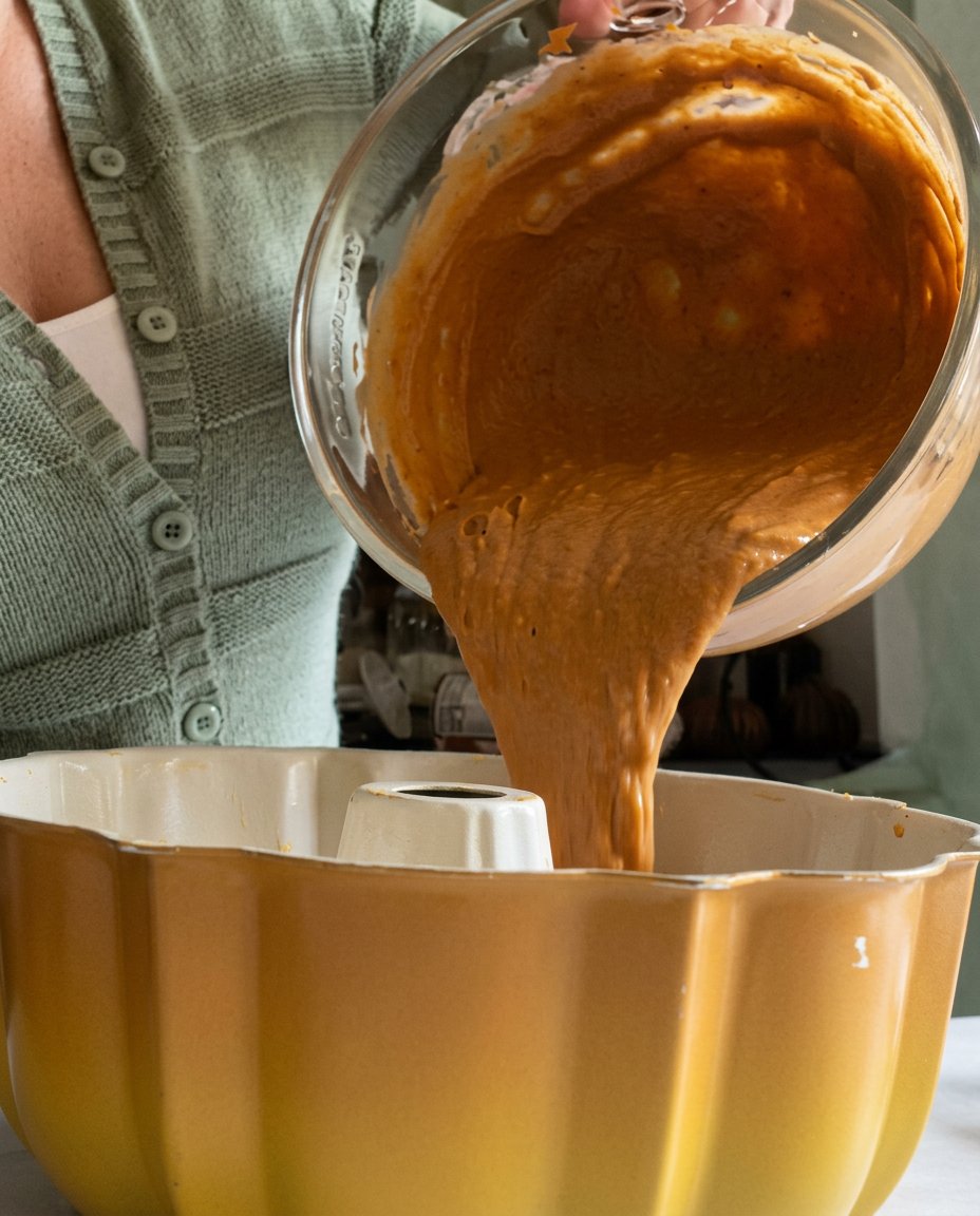 Showing the clean release of a spiced pumpkin spice bundt cake onto a wire cooling rack